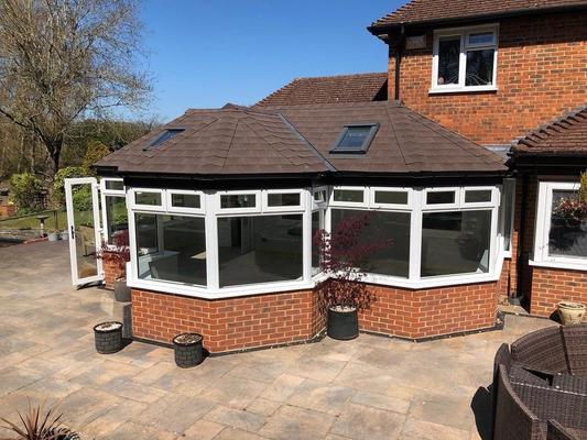 Modern conservatory with energy-efficient roof replacement